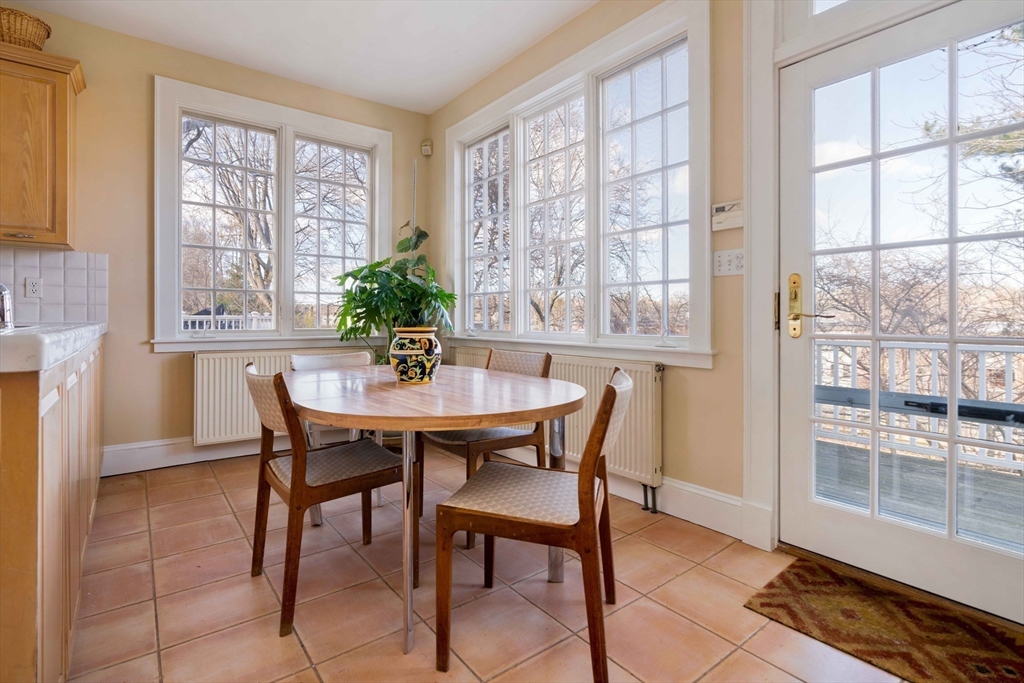 289 Clinton Road Brookline, MA 02445 - Photo 4 of 24 a table and chairs in a room
