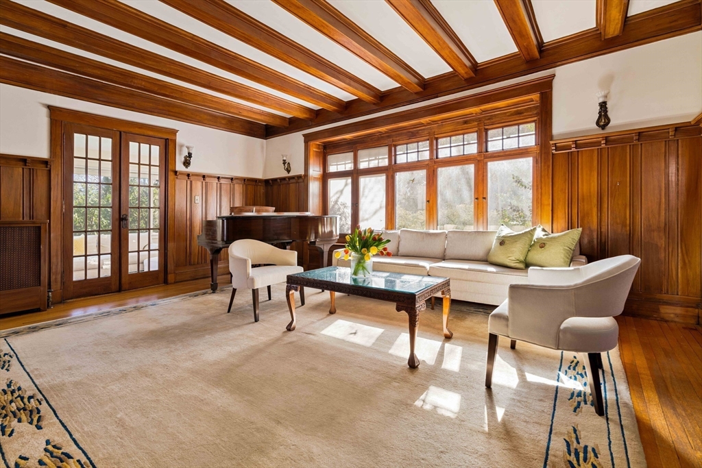 289 Clinton Road Brookline, MA 02445 - Photo 8 of 24 a living room with furniture a ceiling fan and a large window