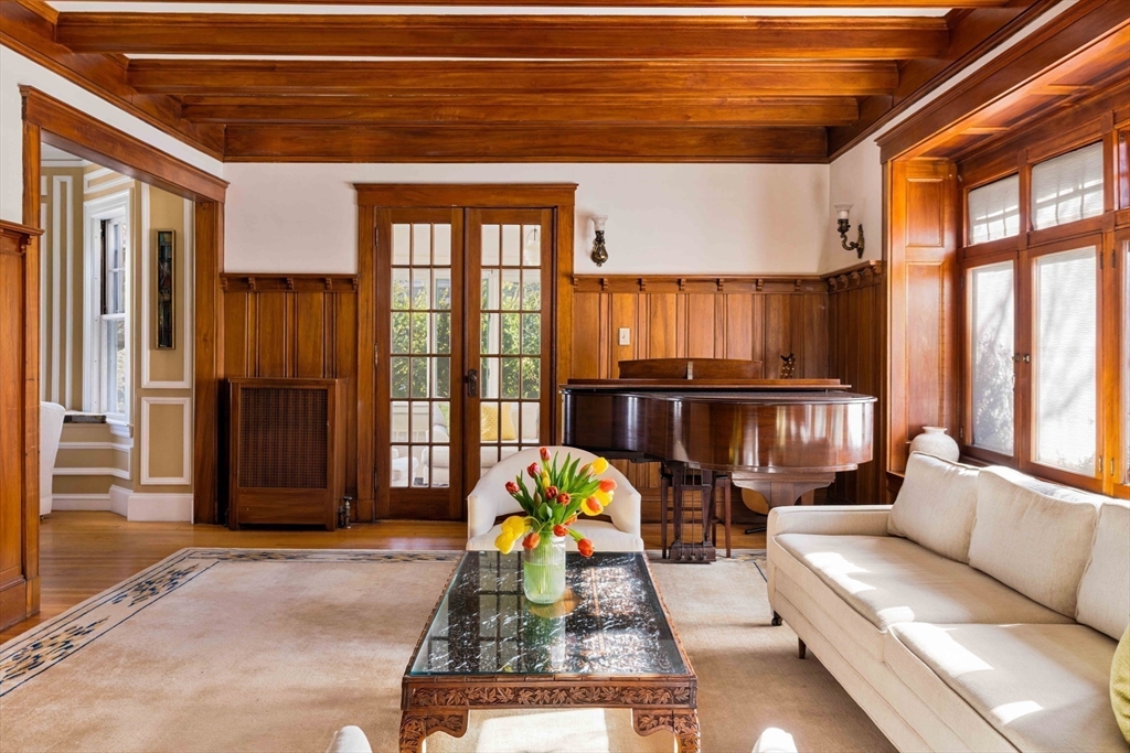 289 Clinton Road Brookline, MA 02445 - Photo 9 of 24 a living room with furniture and a floor to ceiling window
