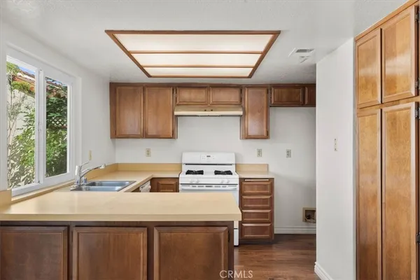 a kitchen with a stove and a refrigerator