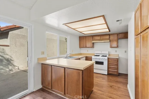 a kitchen with a stove and a sink