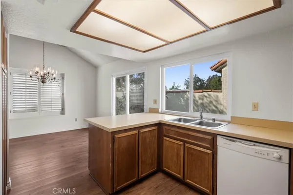 a kitchen with a sink and large window