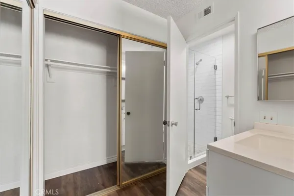 a bathroom with a sink and a shower