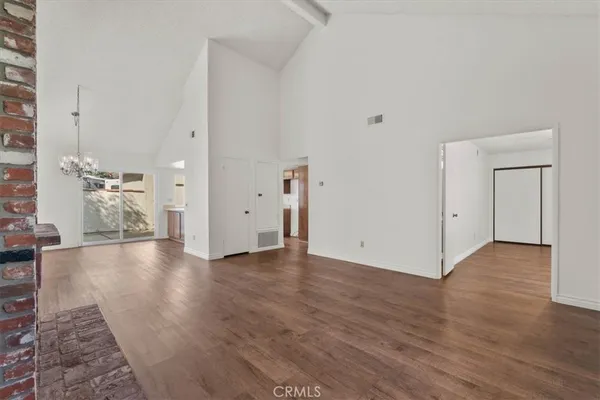 a view of a livingroom with wooden floor