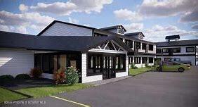 a view of house with a yard in front of it