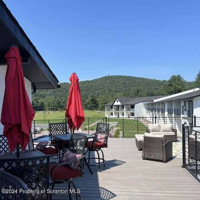 201 Resort Lane Tunkhannock, PA 18657 - Photo 24 of 32 a view of a balcony with two chairs and a table