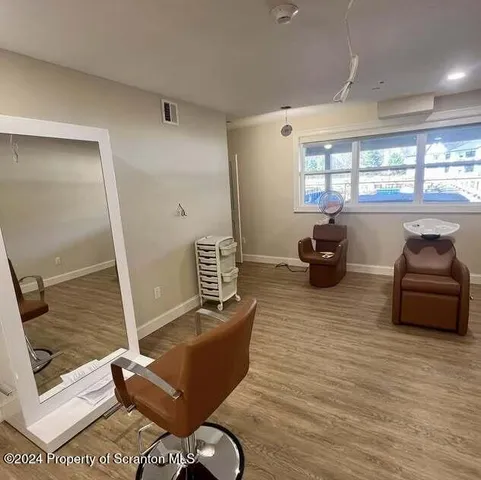 a living room with furniture rug and window