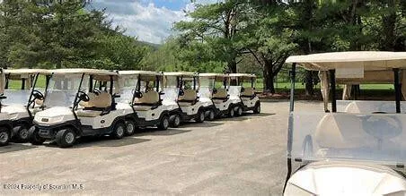 a view of a patio with table and chairs