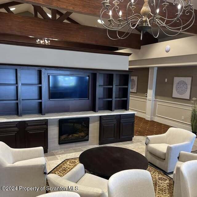 201 Resort Lane Tunkhannock, PA 18657 - Photo 5 of 32 a living room with furniture a flat screen tv and kitchen view