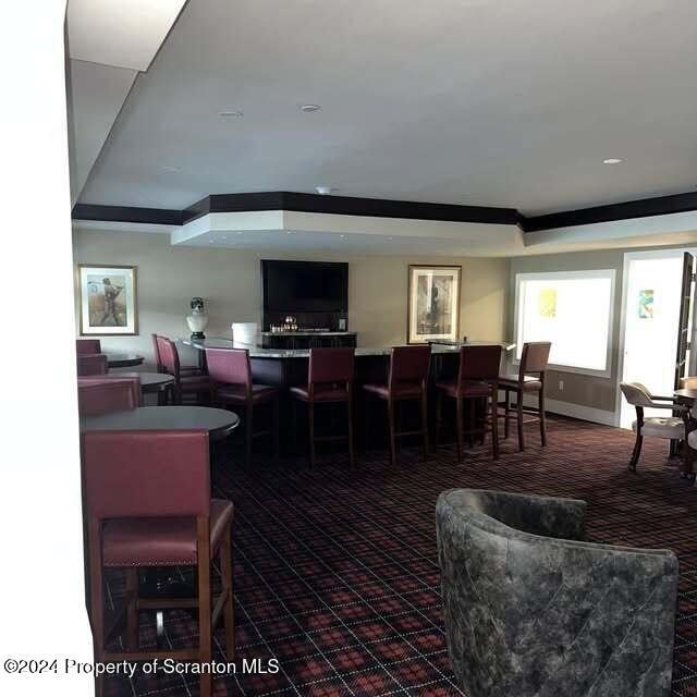 201 Resort Lane Tunkhannock, PA 18657 - Photo 8 of 32 a living room with furniture a large window and a dining table