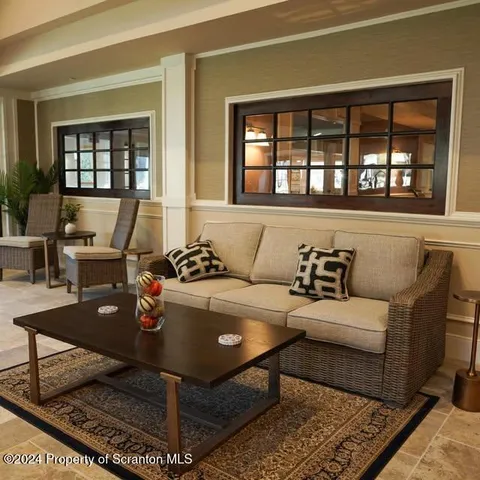 a living room with a couch and a table