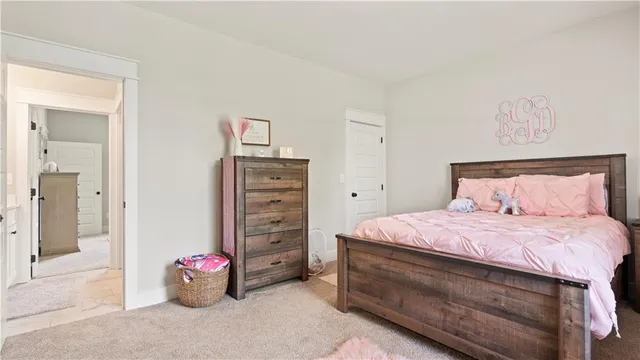a bedroom with a bed and a cabinets