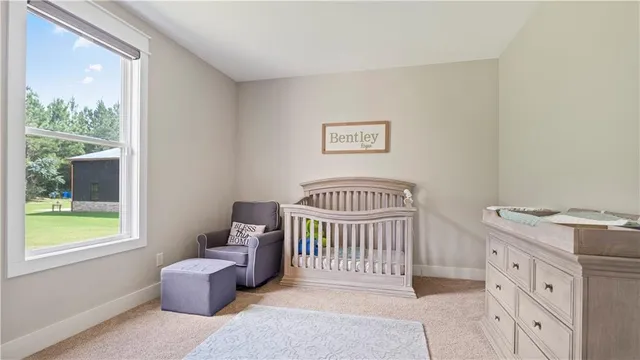 a bedroom with furniture and a window