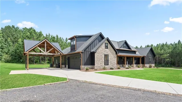 a front view of house with yard and green space