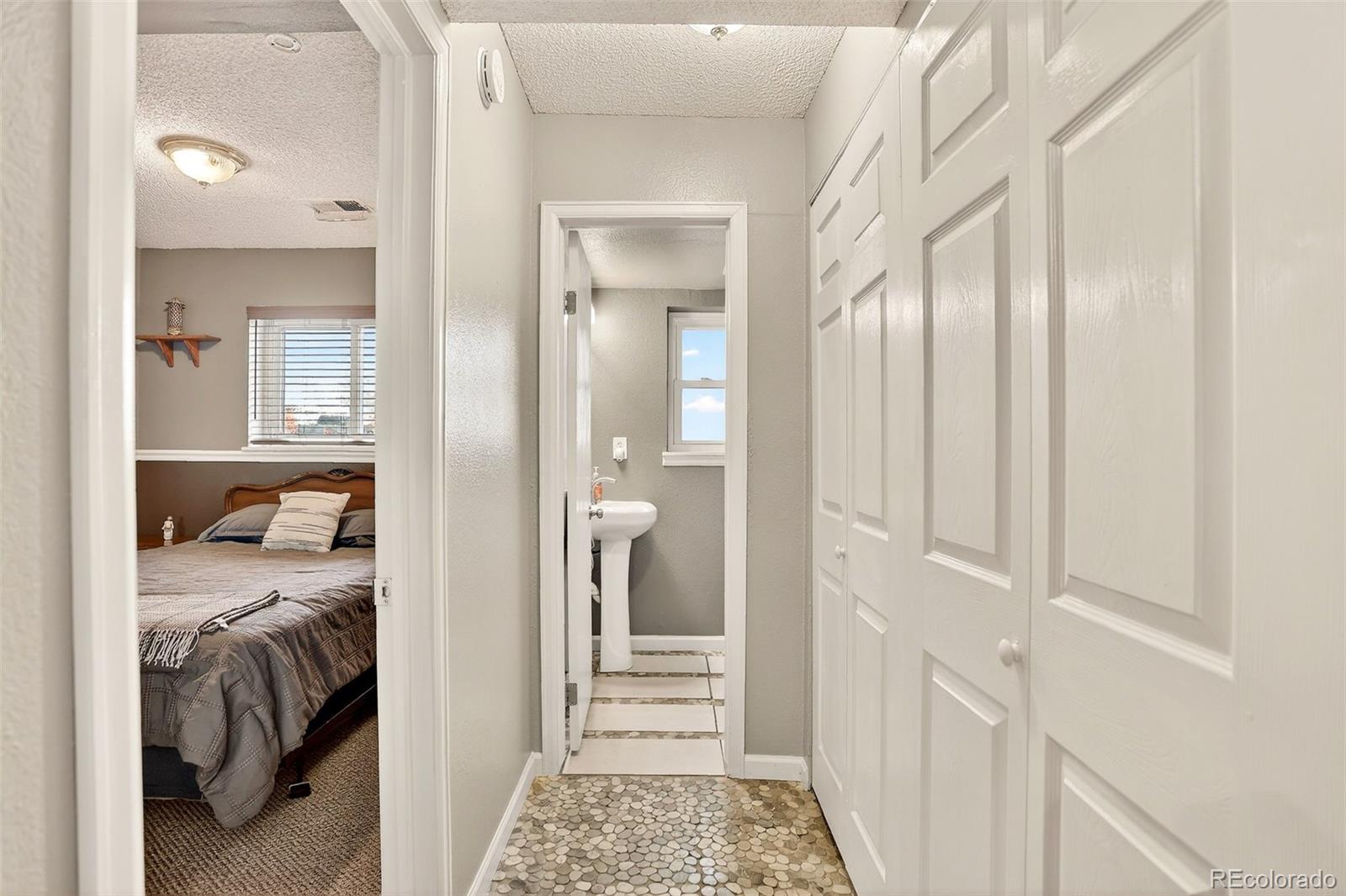 1503 South Mobile Street Aurora, CO 80017 - Photo 16 of 19 a view of a bedroom from a hallway