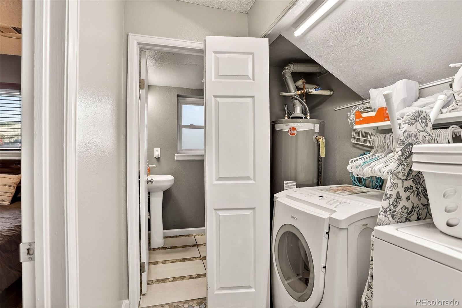 1503 South Mobile Street Aurora, CO 80017 - Photo 17 of 19 a utility room with dryer and washer