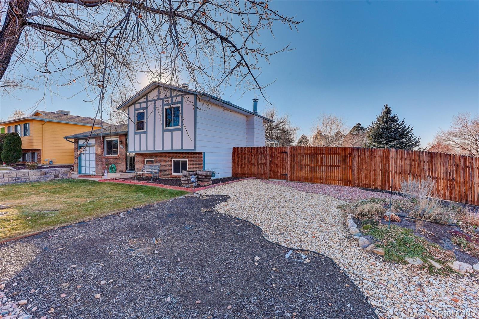 1503 South Mobile Street Aurora, CO 80017 - Photo 2 of 19 a house view with a backyard space