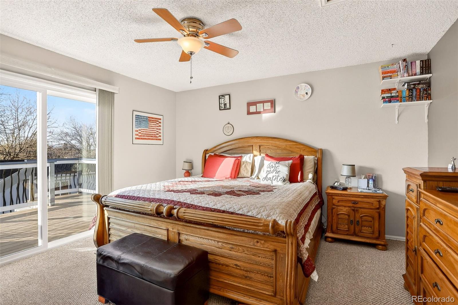 1503 South Mobile Street Aurora, CO 80017 - Photo 8 of 19 a bedroom with a bed and a chandelier