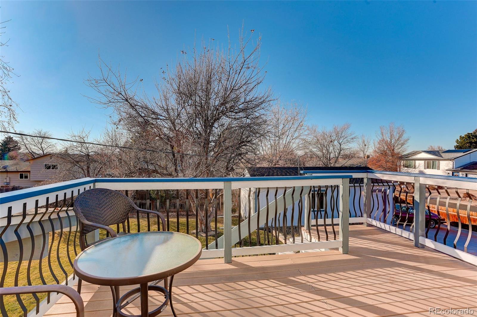 1503 South Mobile Street Aurora, CO 80017 - Photo 10 of 19 a view of a deck with wooden floor and furniture