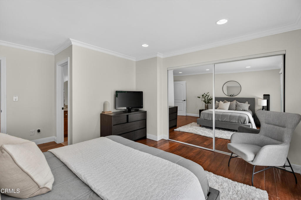 9325 La Shell Drive Tujunga, CA 91042 - Photo 18 of 46 a bedroom with a bed and a flat screen tv