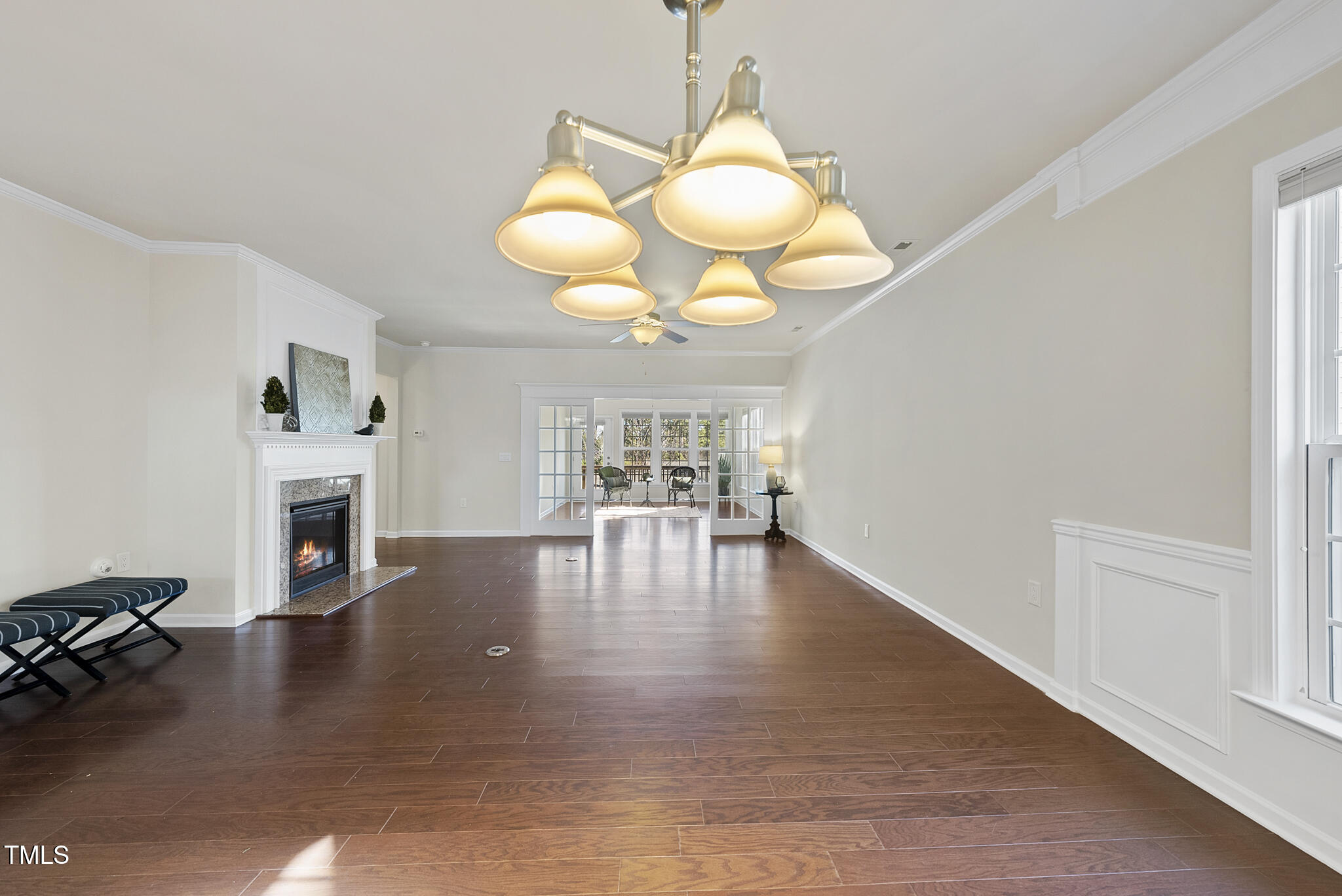 821 Blackfriars Loop Cary, NC 27519 - Photo 11 of 29 a view of a livingroom with fireplace wooden floor and a window