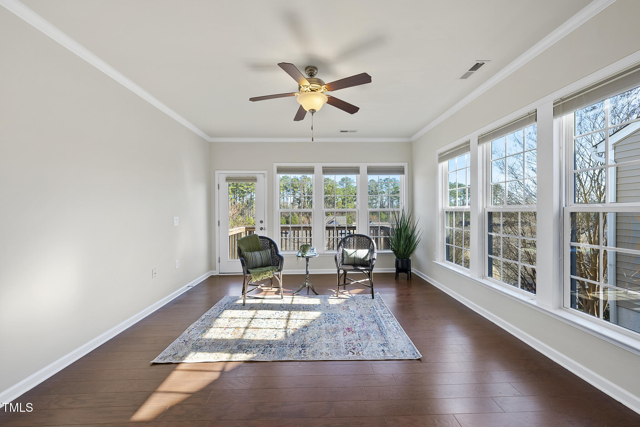 821 Blackfriars Loop Cary, NC 27519 - Photo 16 of 29 a living room with furniture and a floor to ceiling window