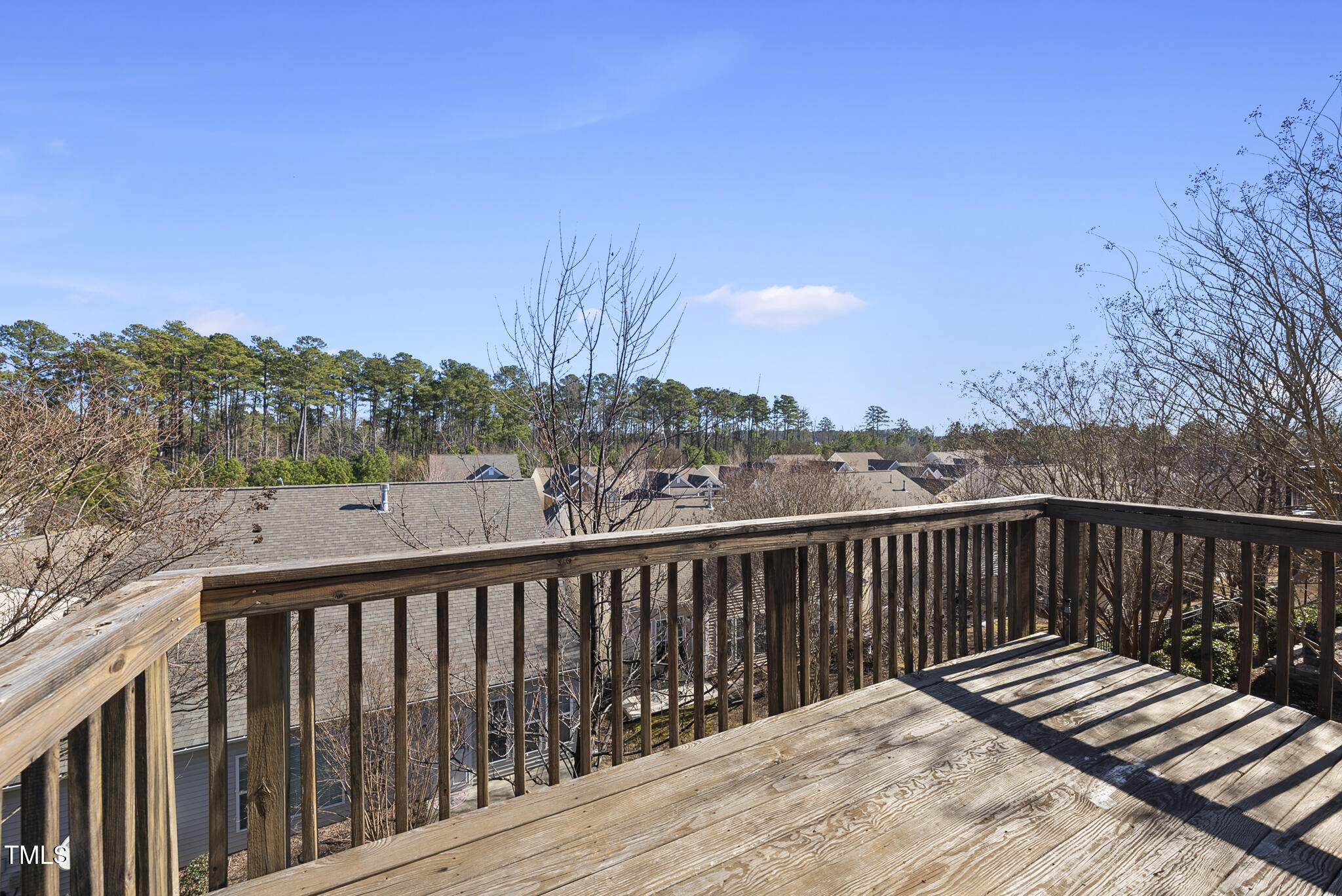 821 Blackfriars Loop Cary, NC 27519 - Photo 17 of 29 a balcony with wooden floor and fence