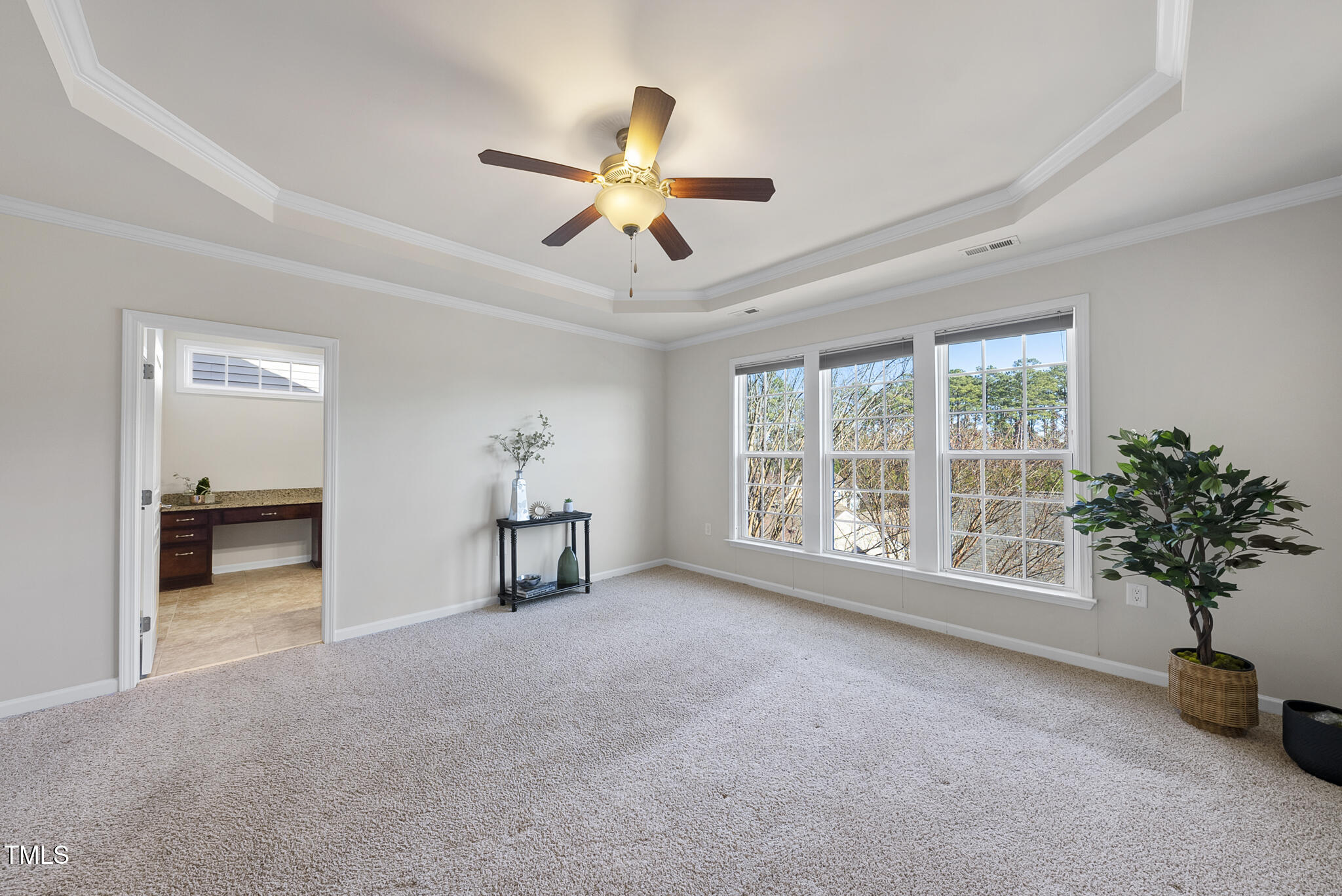 821 Blackfriars Loop Cary, NC 27519 - Photo 18 of 29 a view of livingroom with furniture and a ceiling fan