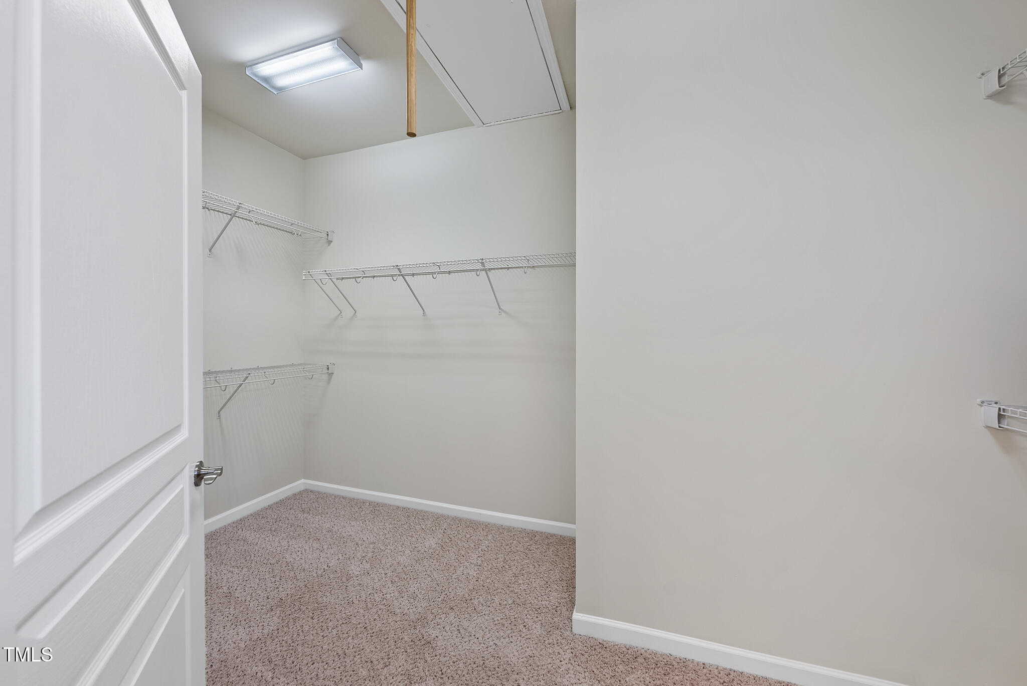821 Blackfriars Loop Cary, NC 27519 - Photo 21 of 29 a view of a room with racks on the wall