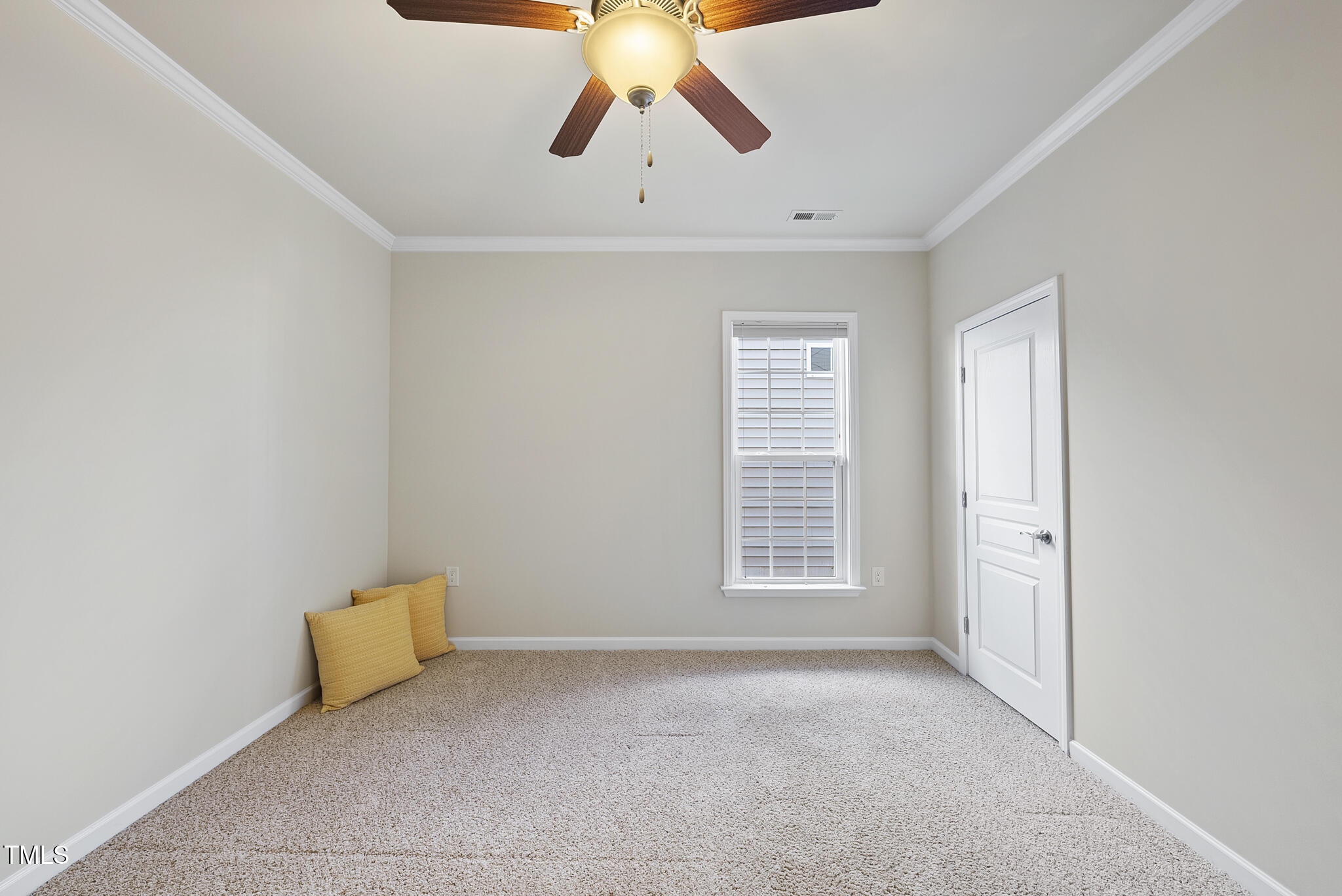 821 Blackfriars Loop Cary, NC 27519 - Photo 22 of 29 a view of an empty room with a window