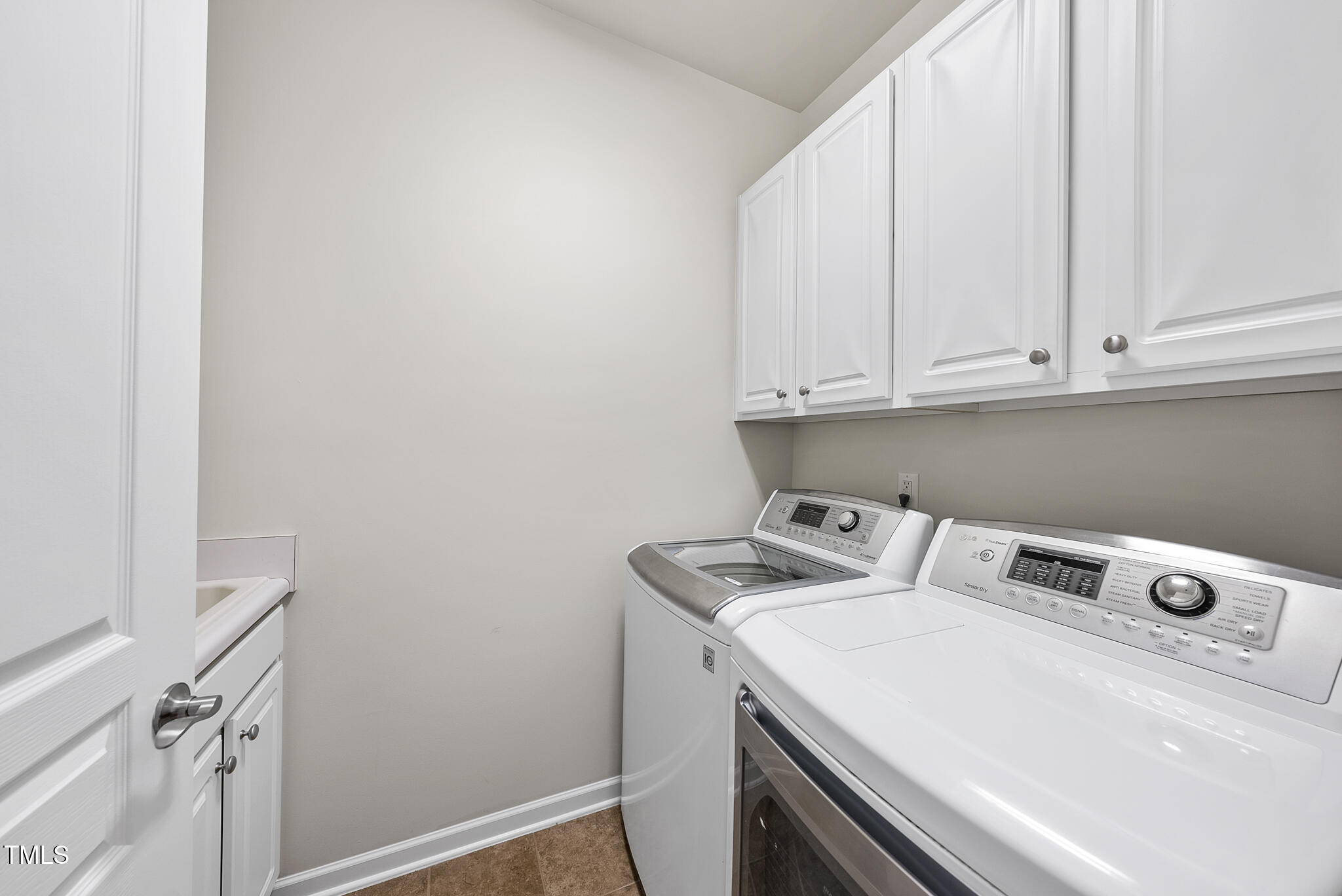 821 Blackfriars Loop Cary, NC 27519 - Photo 25 of 29 a utility room with dryer and washer