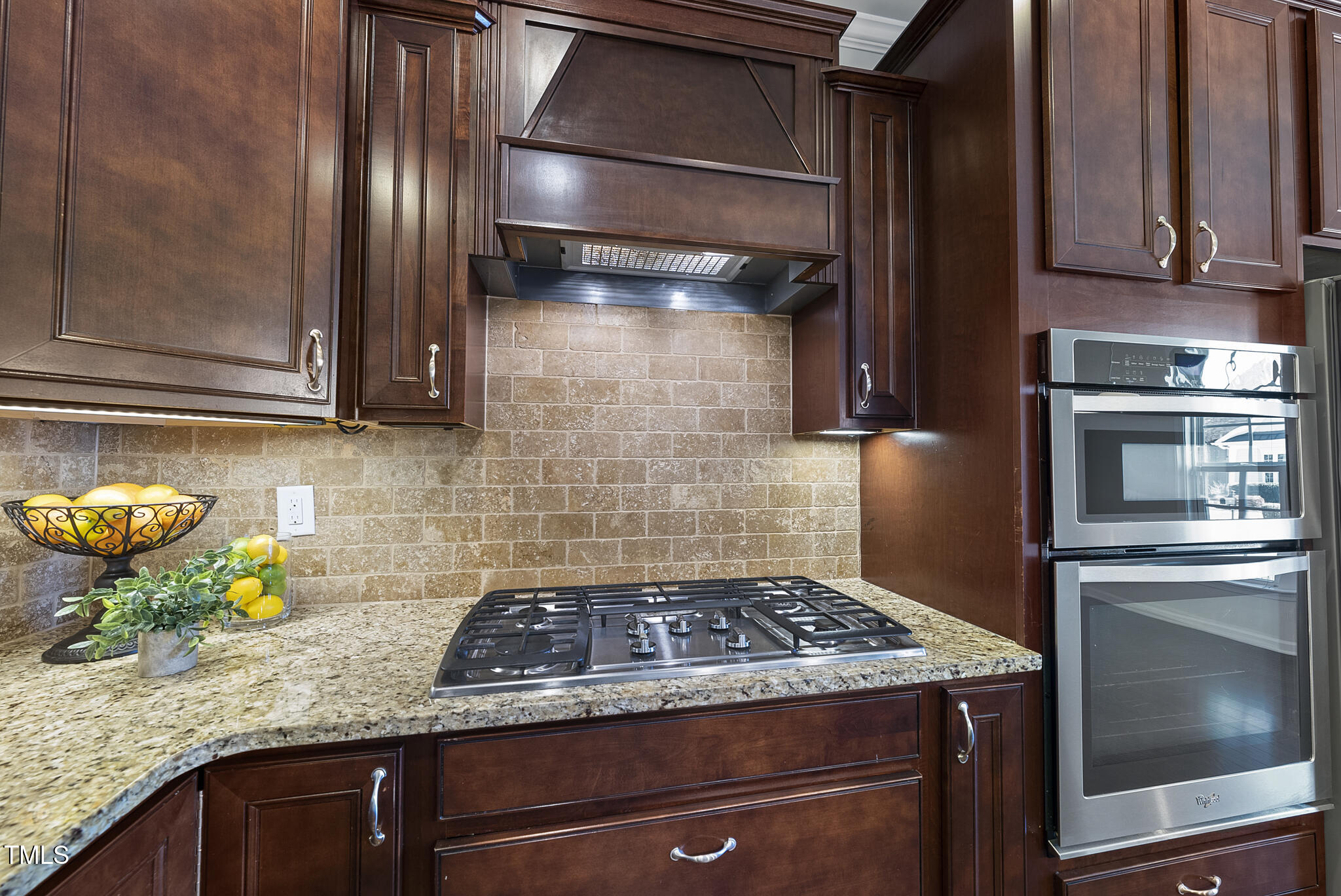 821 Blackfriars Loop Cary, NC 27519 - Photo 5 of 29 a stove top oven sitting inside of a kitchen