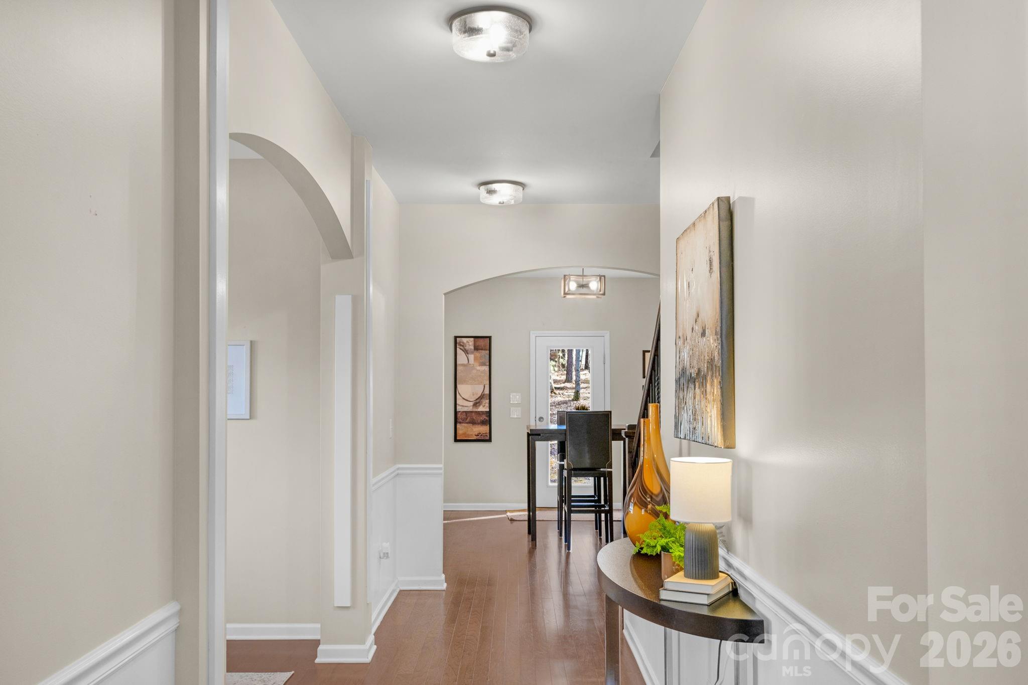 1508 Springfield Drive Waxhaw, NC 28173 - Photo 12 of 48 a view of a hallway with furniture and wooden floor