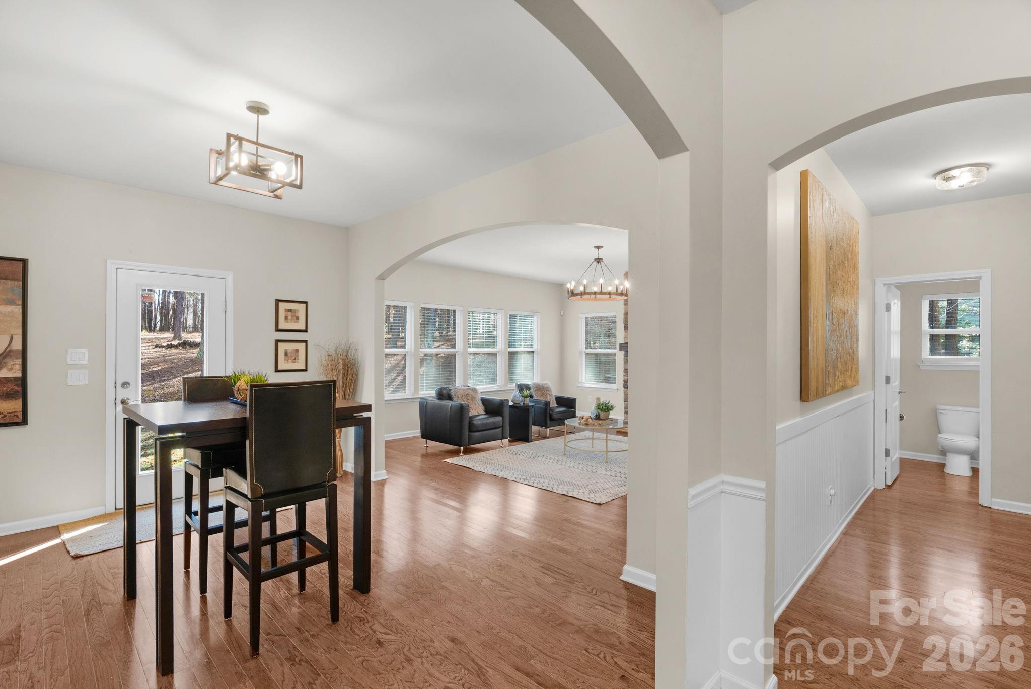 1508 Springfield Drive Waxhaw, NC 28173 - Photo 18 of 48 a view of a livingroom with furniture dining space and wooden floor