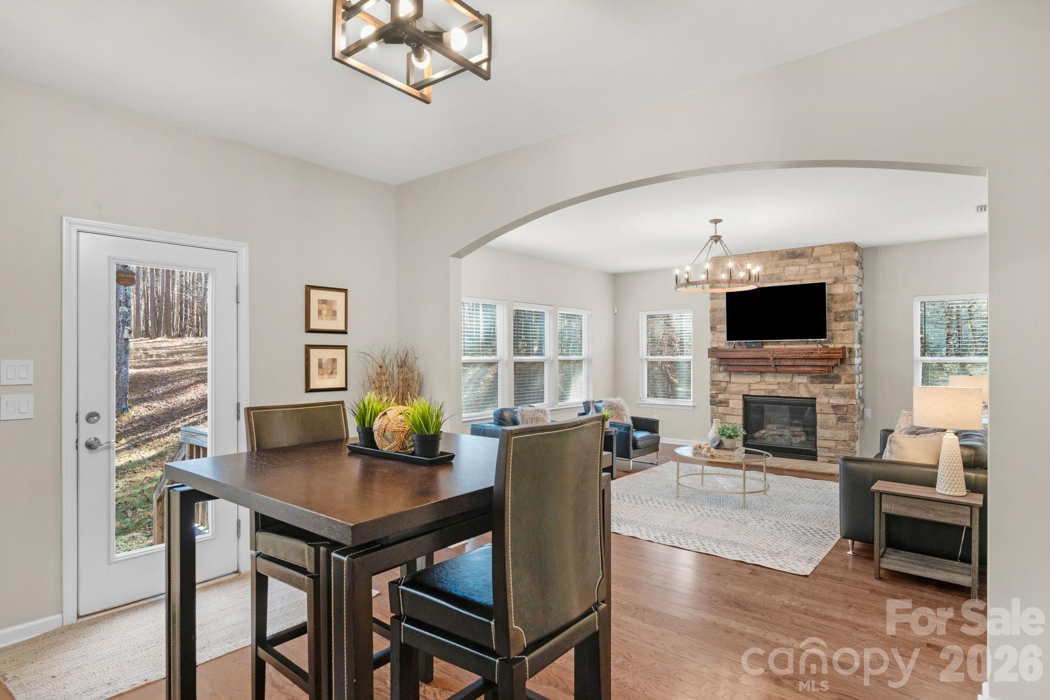 1508 Springfield Drive Waxhaw, NC 28173 - Photo 19 of 48 a living room with furniture a fireplace and a flat screen tv