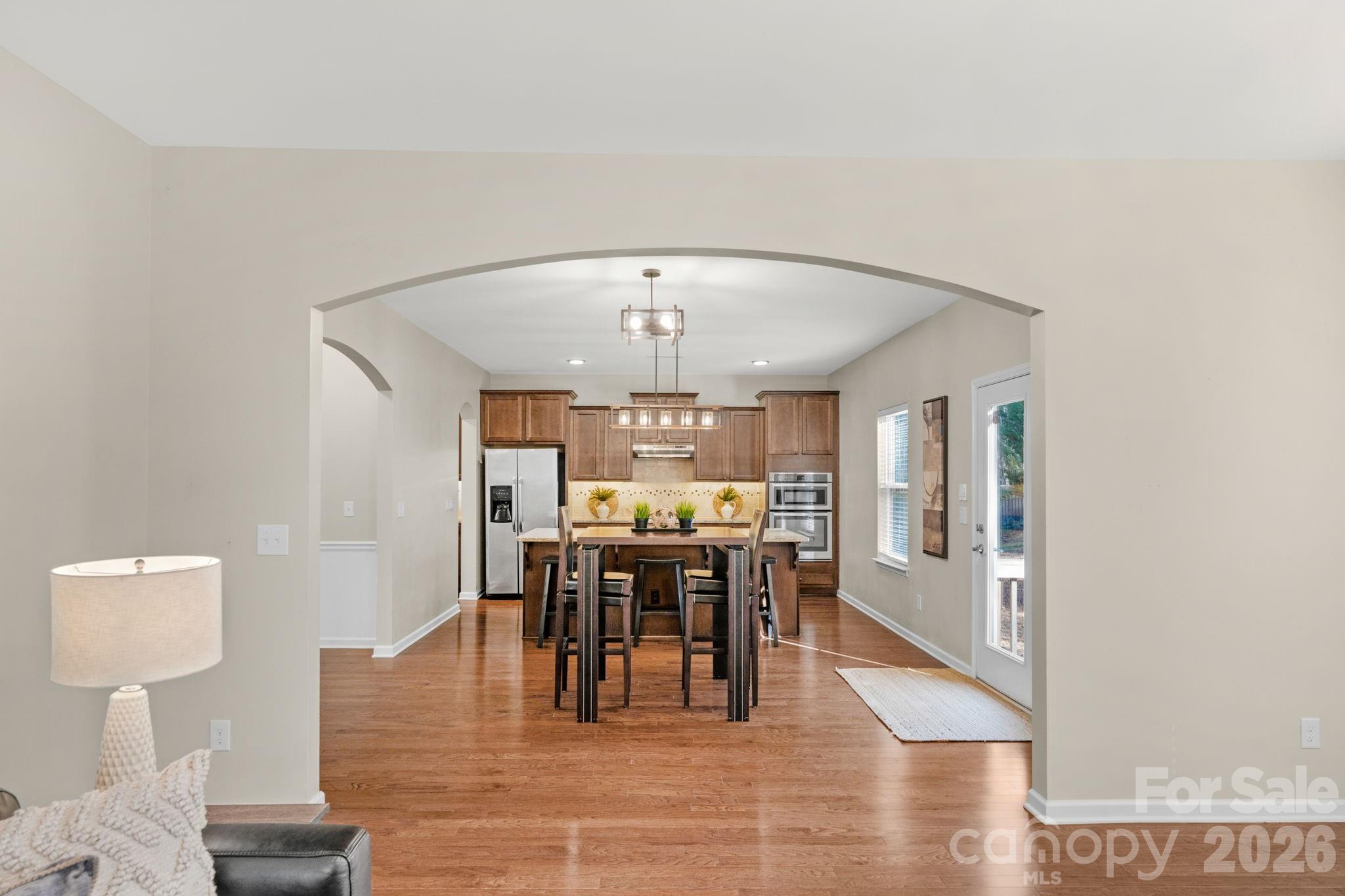 1508 Springfield Drive Waxhaw, NC 28173 - Photo 23 of 48 a view of a dining room with furniture window and wooden floor