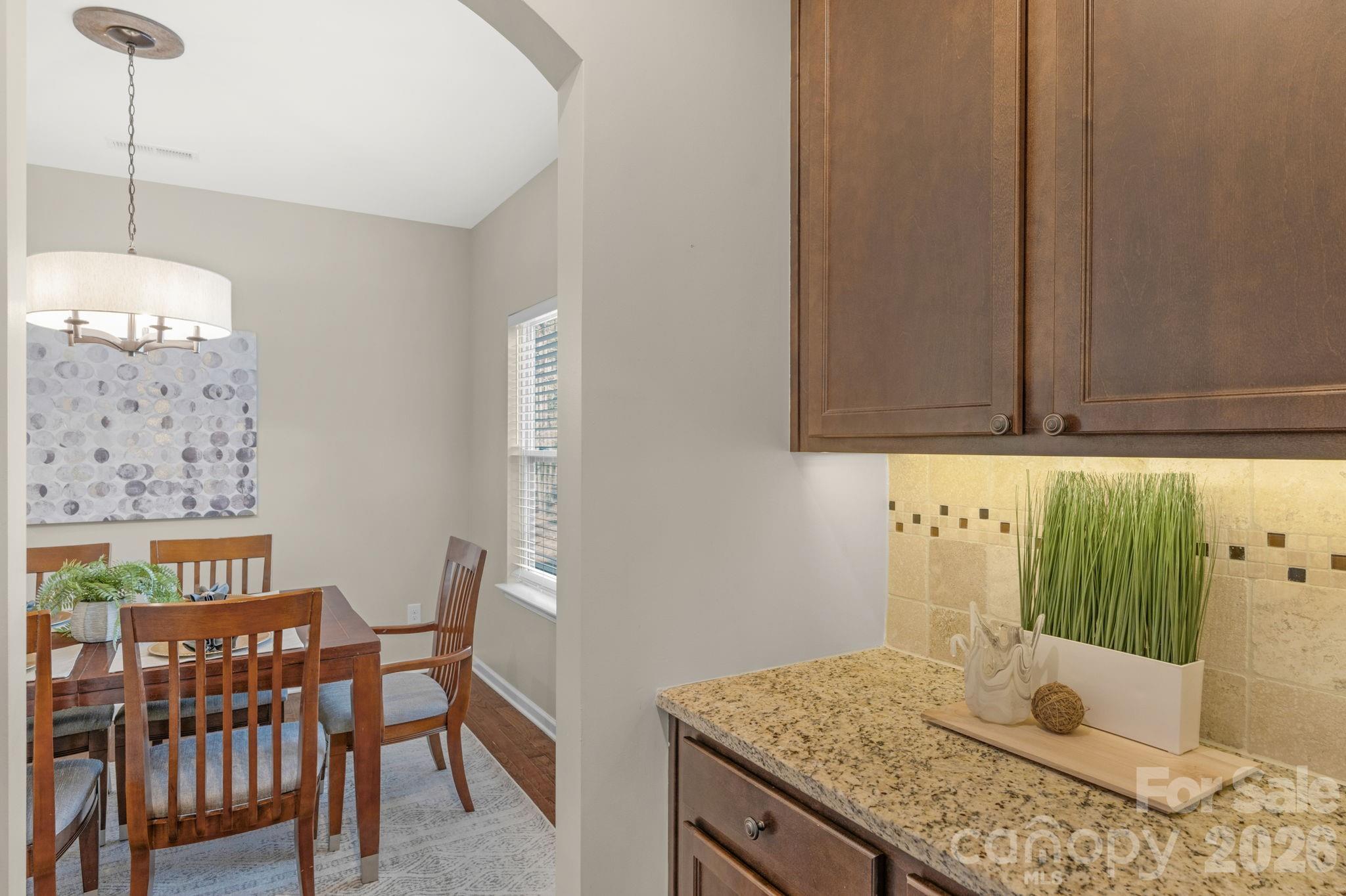 1508 Springfield Drive Waxhaw, NC 28173 - Photo 25 of 48 a bathroom with a granite countertop sink and a mirror