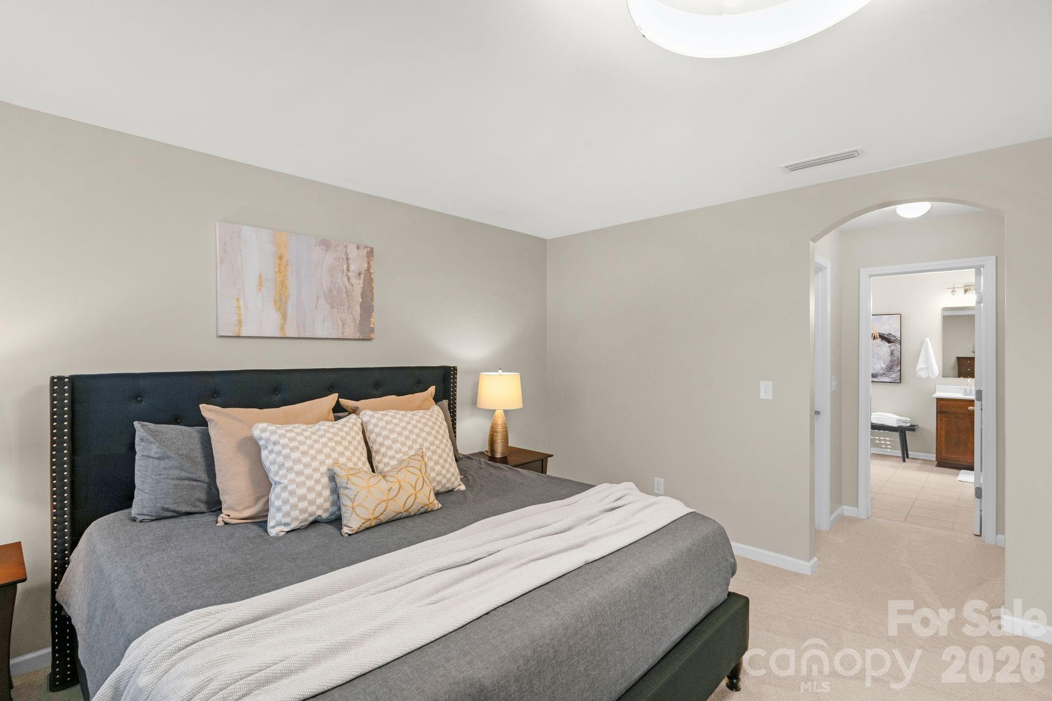 1508 Springfield Drive Waxhaw, NC 28173 - Photo 30 of 48 a bedroom with a bed and painting on the wall