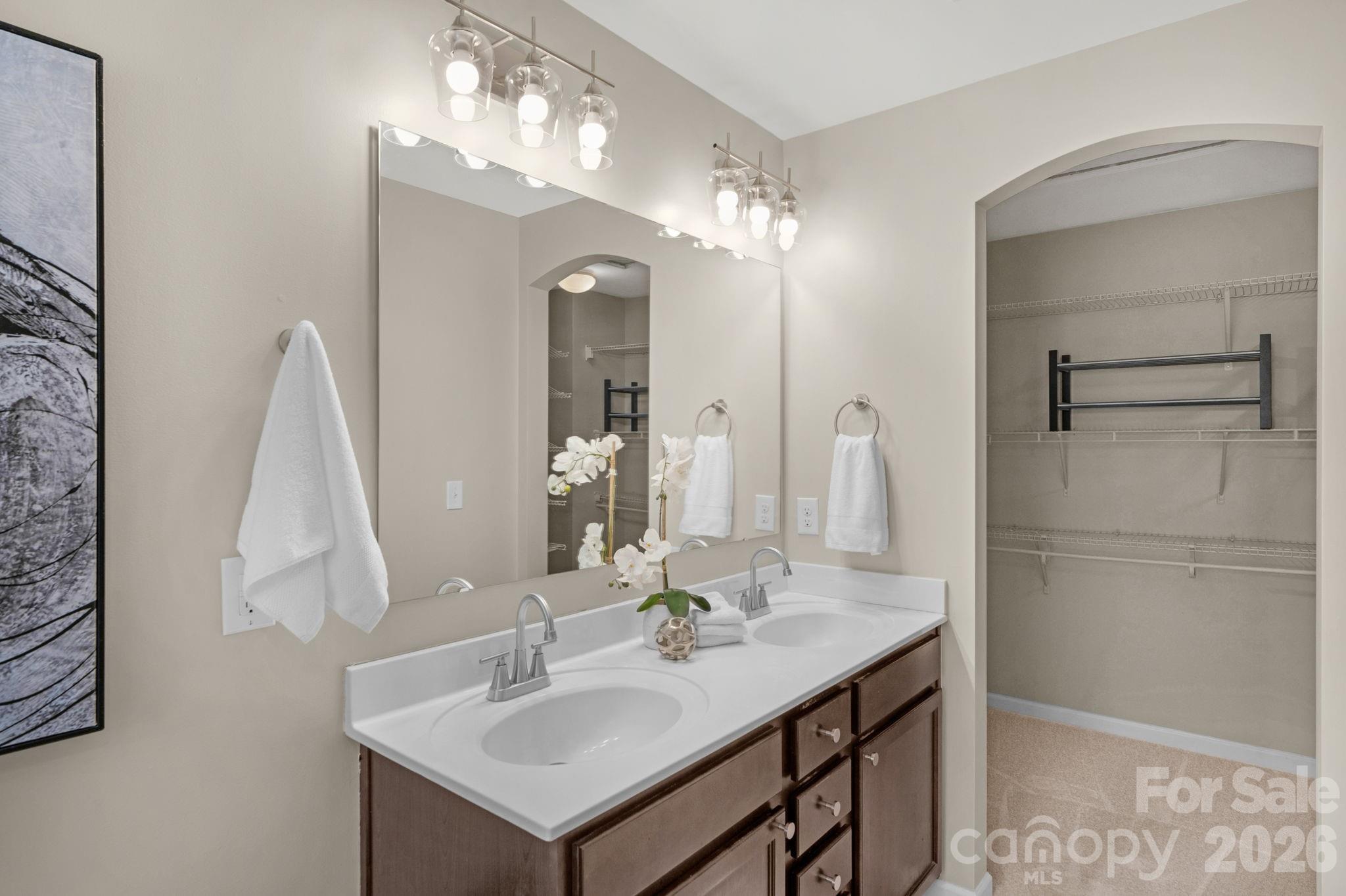 1508 Springfield Drive Waxhaw, NC 28173 - Photo 33 of 48 a bathroom with a sink vanity and a mirror