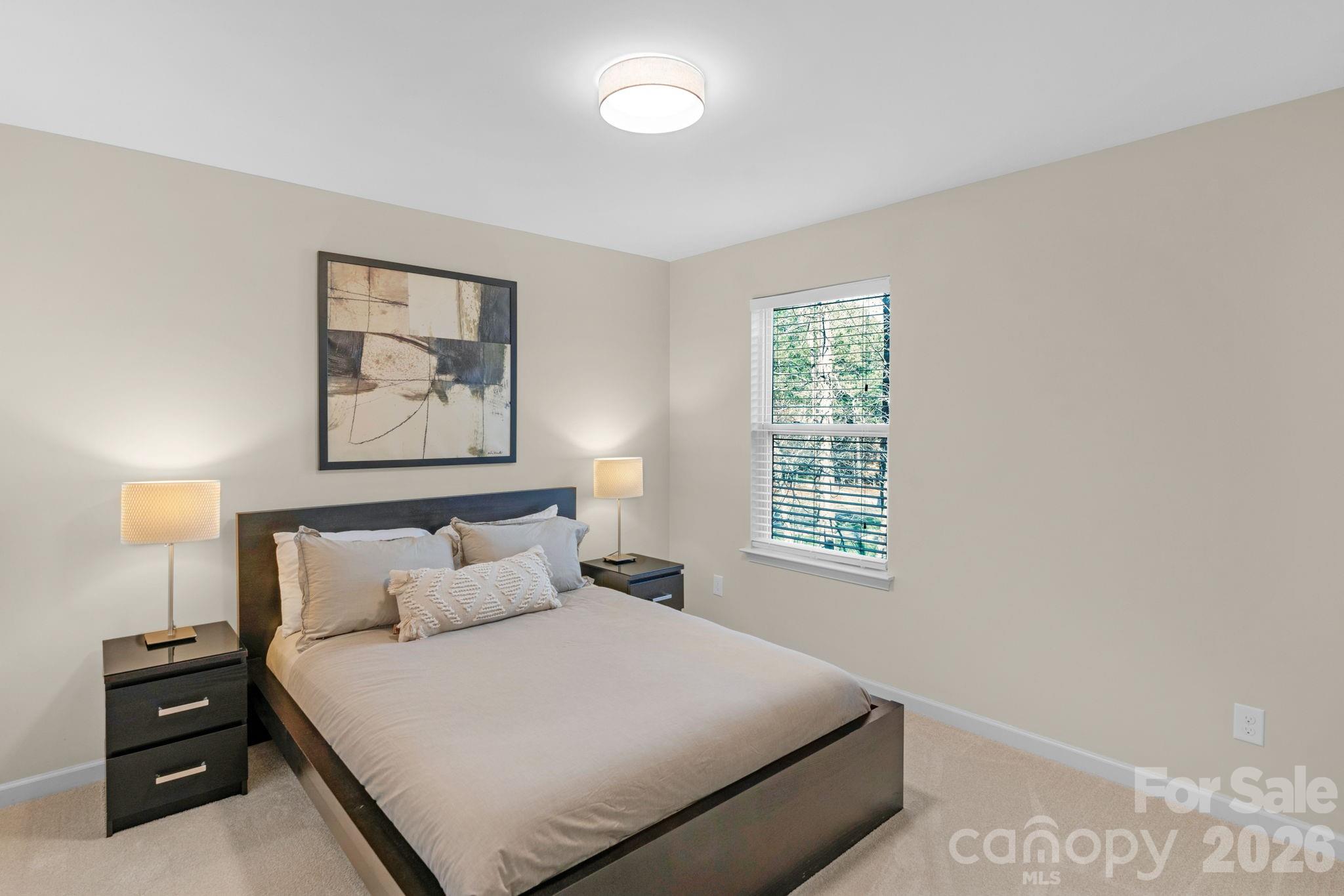 1508 Springfield Drive Waxhaw, NC 28173 - Photo 35 of 48 a bedroom with a bed and a night stand