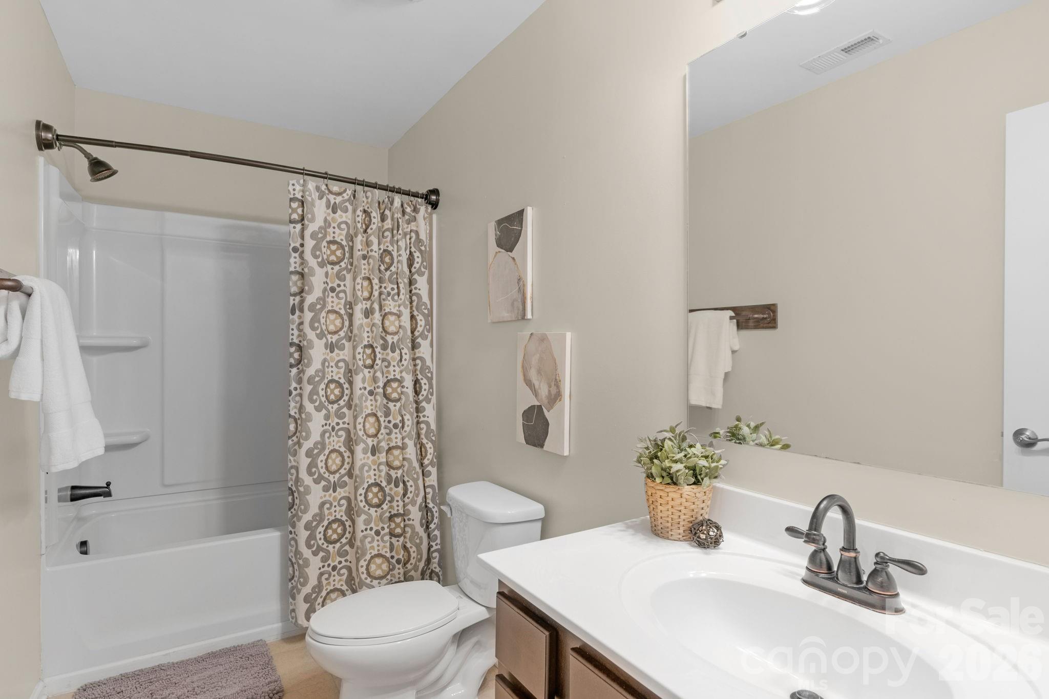 1508 Springfield Drive Waxhaw, NC 28173 - Photo 36 of 48 a bathroom with a sink toilet and shower