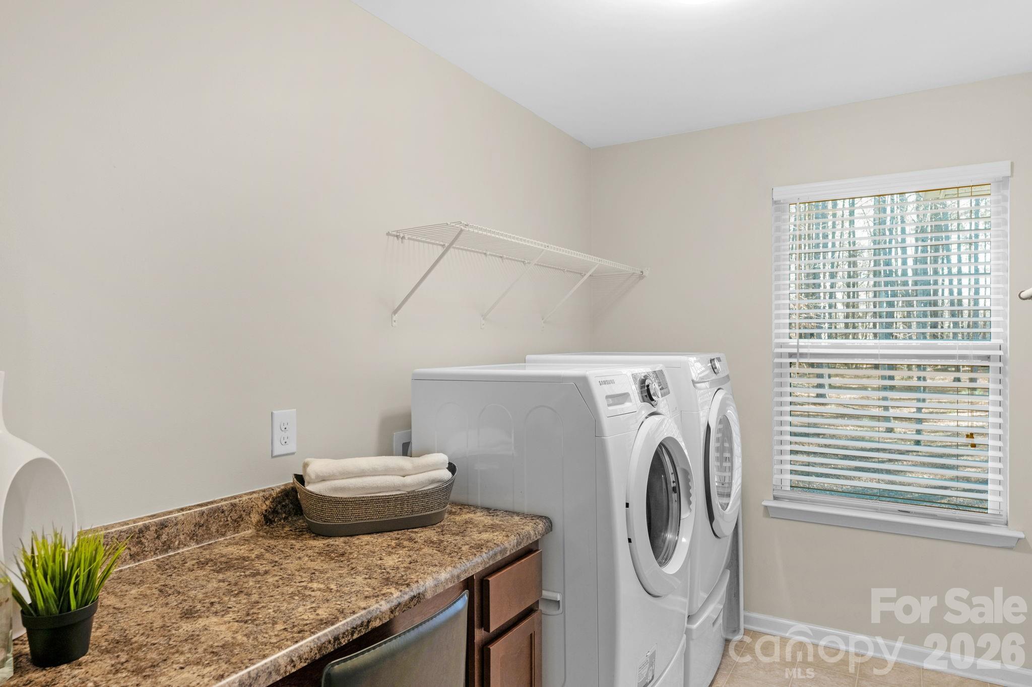 1508 Springfield Drive Waxhaw, NC 28173 - Photo 40 of 48 a utility room with dryer and washer
