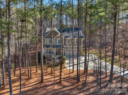 a view of a house with a iron gate