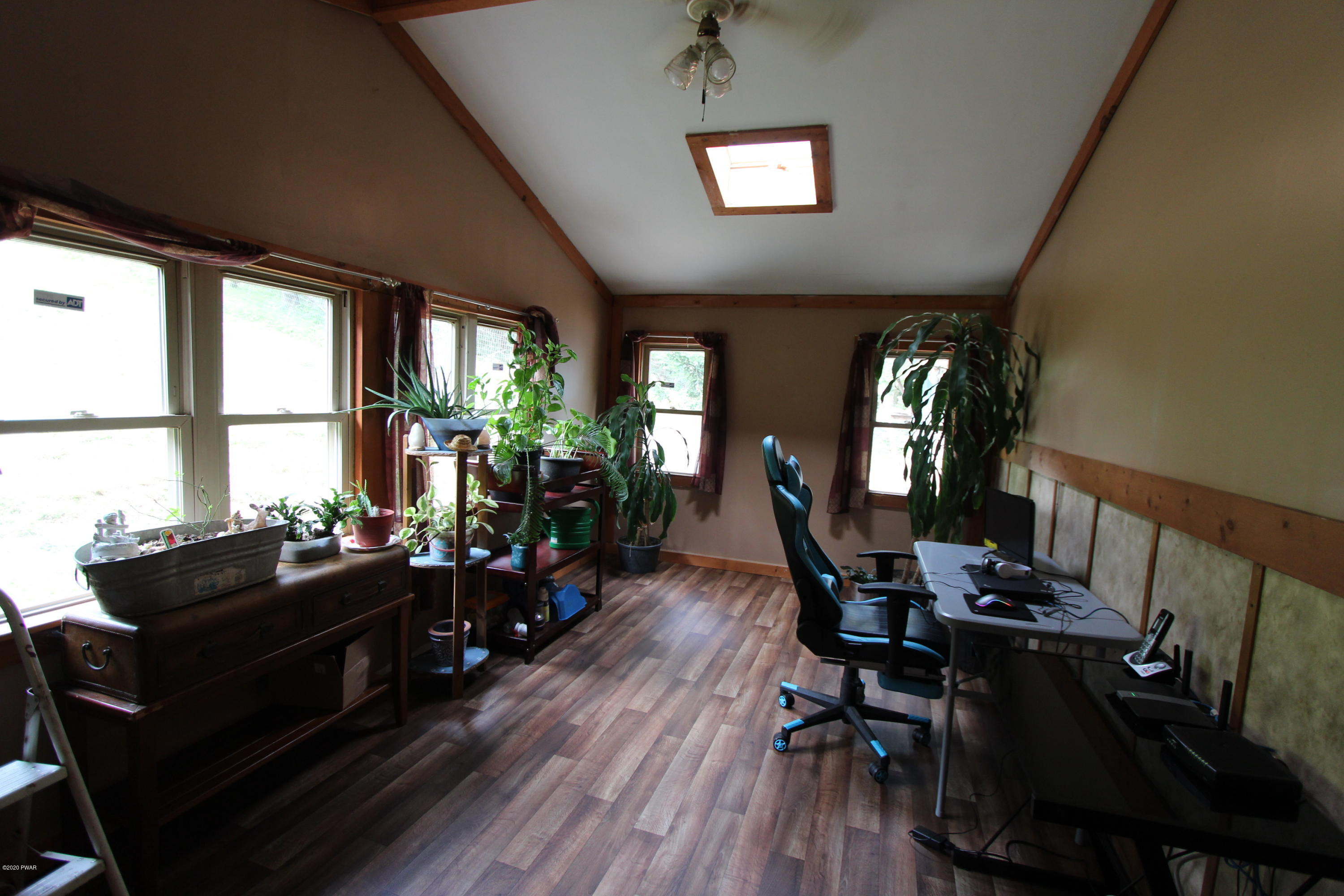 89 Sterling Gardens Road Moscow, PA 18444 - Photo 13 of 22 a living room with furniture and wooden floor