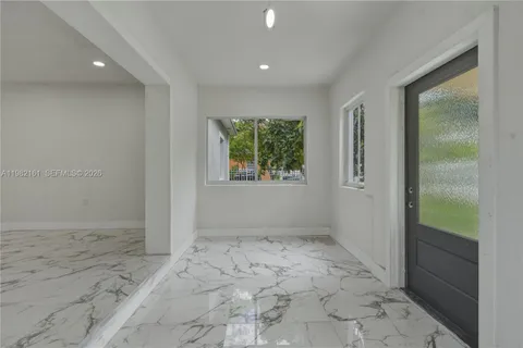 a view of an empty room and window