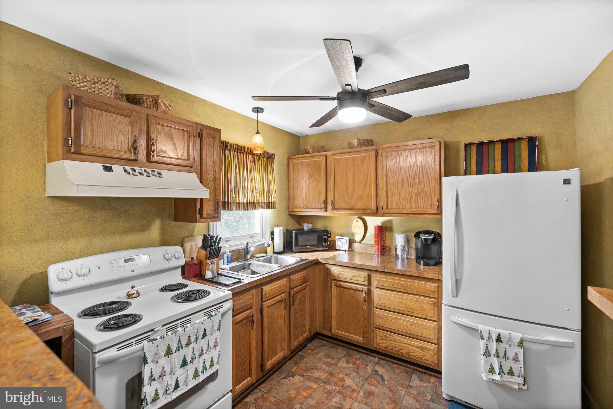 227 Cedar Ridge Drive Ruther Glen, VA 22546 - Photo 11 of 44 a kitchen that has a cabinets and appliances