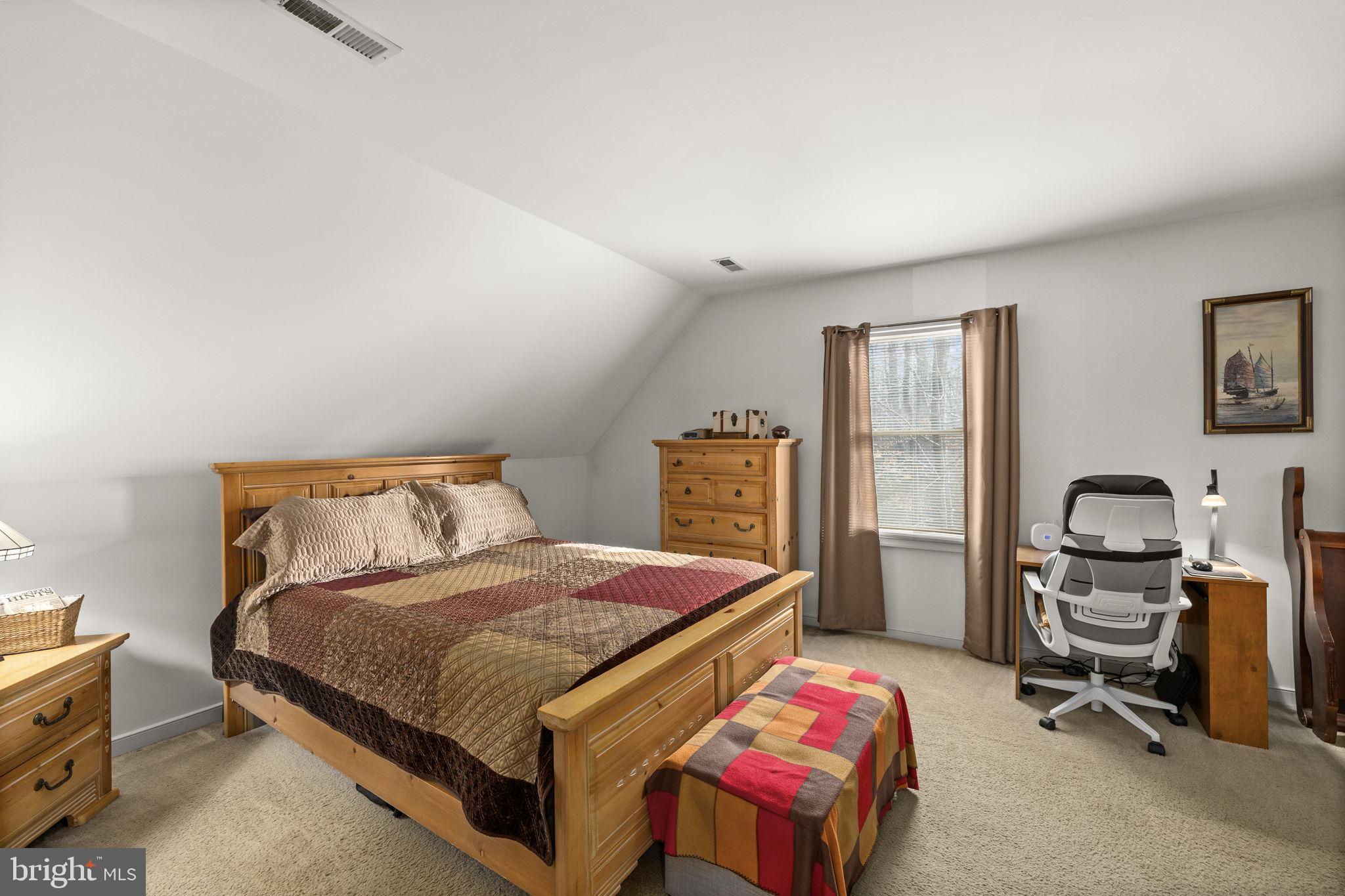 227 Cedar Ridge Drive Ruther Glen, VA 22546 - Photo 16 of 44 a bedroom with a bed and a cabinets