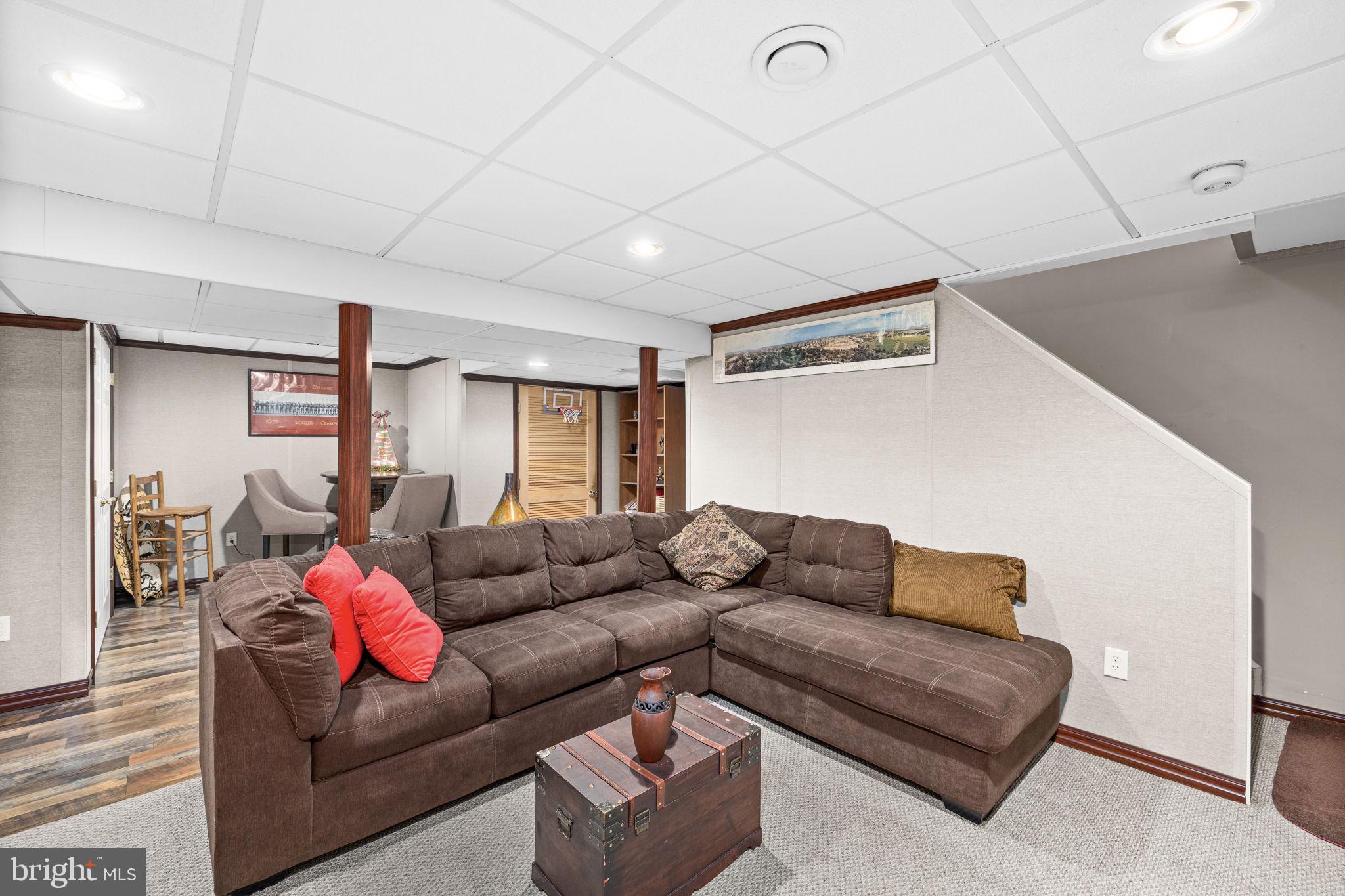 227 Cedar Ridge Drive Ruther Glen, VA 22546 - Photo 23 of 44 a living room with furniture and a couch
