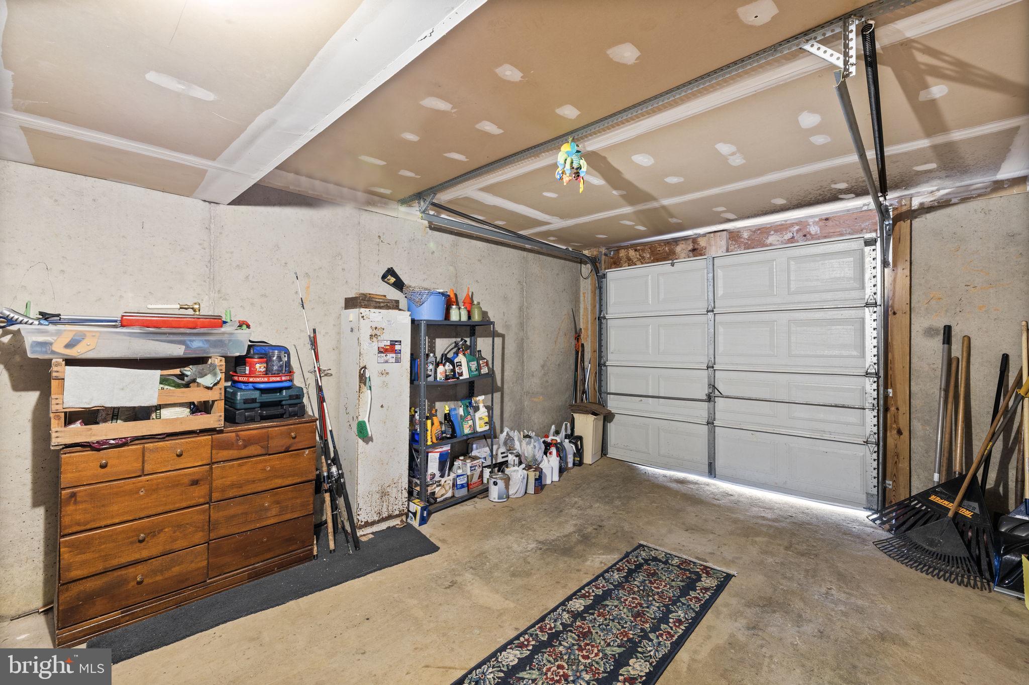 227 Cedar Ridge Drive Ruther Glen, VA 22546 - Photo 27 of 44 a storage room with wooden floor and furniture