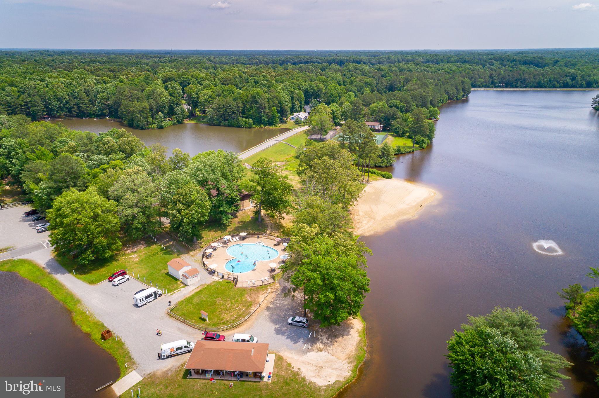 227 Cedar Ridge Drive Ruther Glen, VA 22546 - Photo 34 of 44 an aerial view of a house with a yard and lake view